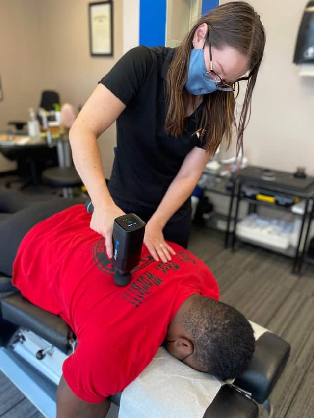muscle recovery on patient in fairfax virginia chiropractic office