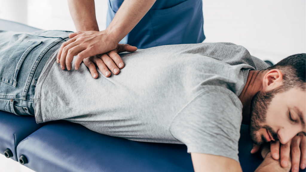 picture of man getting chiropractic adjustment for his back pain in maryland