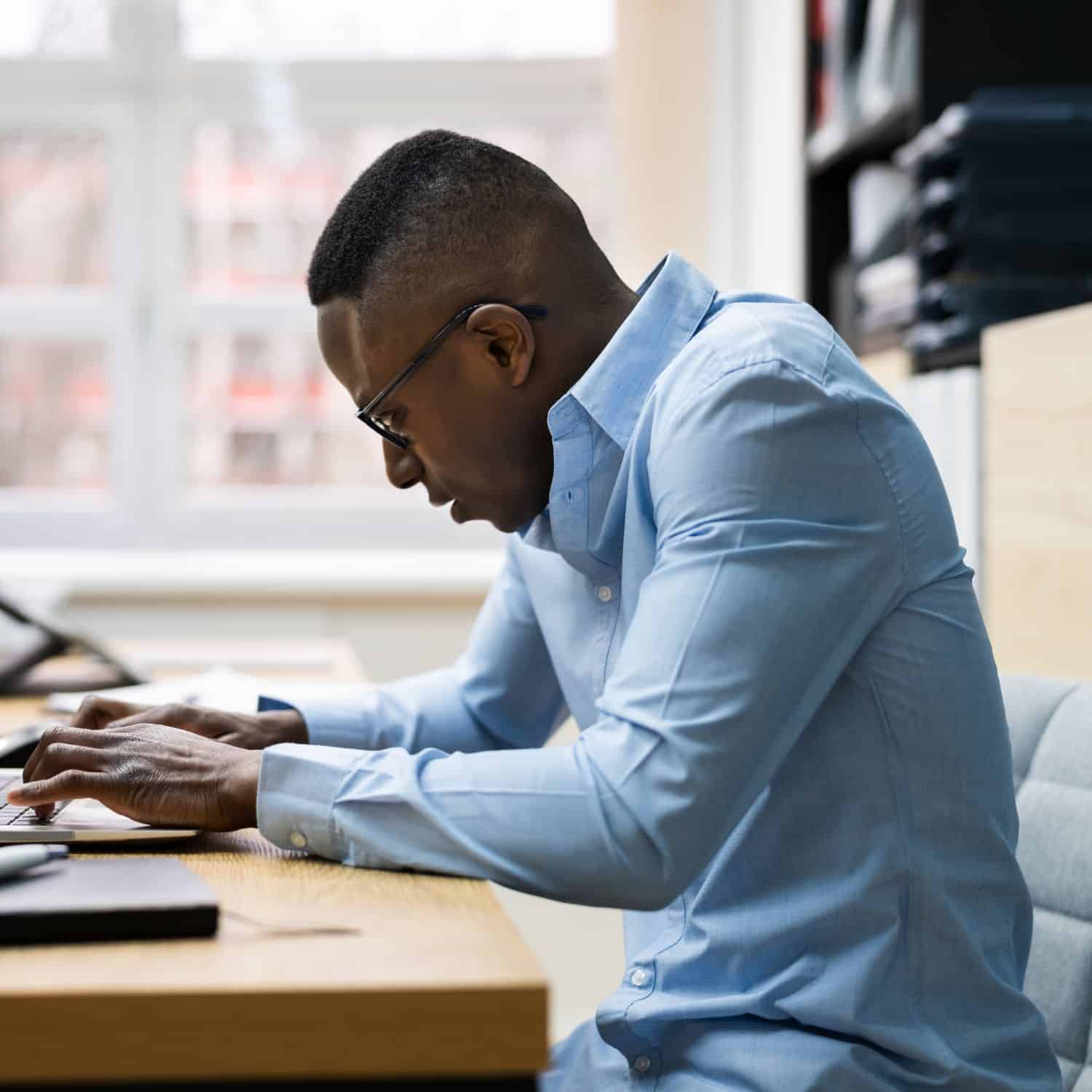 Man in Fairfax with lower back pain due to bad posture - Back Pain Chiropractor in Fairfax