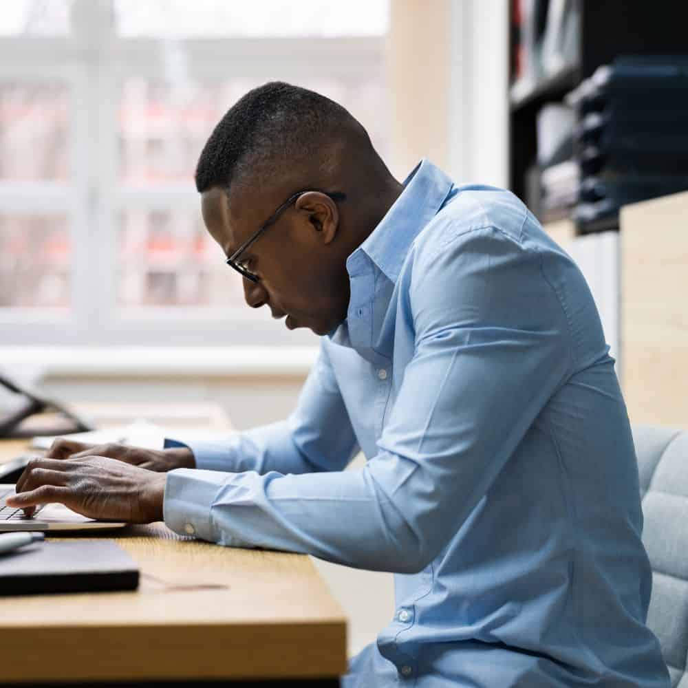 Image of a man in Landover with lower back pain due to bad posture