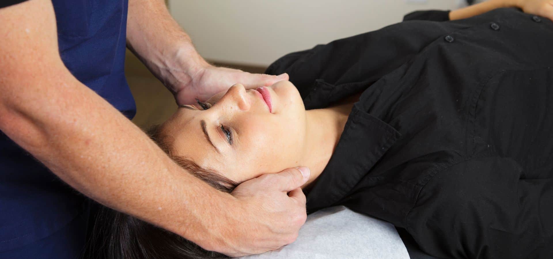 Woman receiving chiropractic adjustments in fairfax VA after a car accident.
