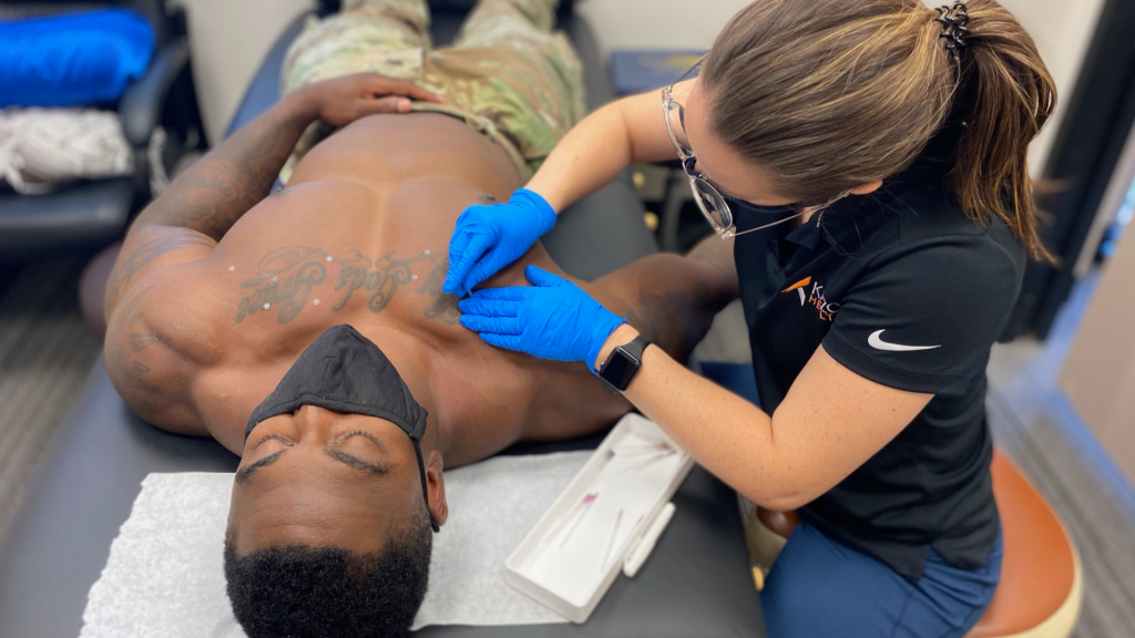 veteran receiving dry needling for chiropractic care in farifax, va 