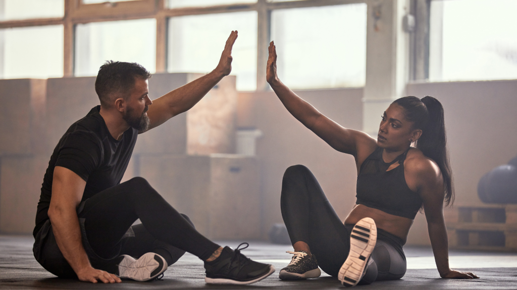two people using injury prevention stretches after reading kaizo healths fitness hacks