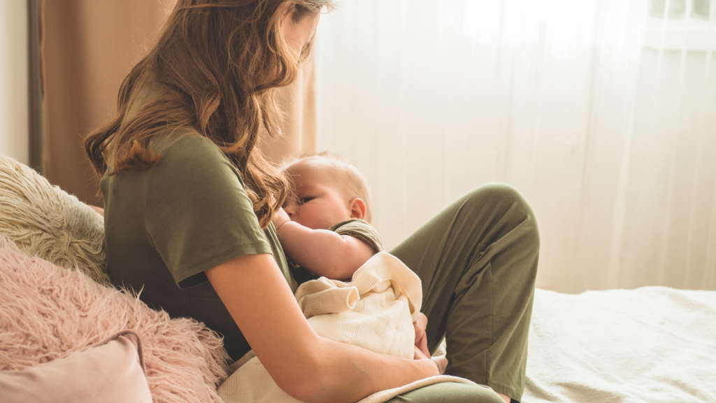 woman breastfeeding her baby and using kaizo tips to avoid neck pain while breastfeeding