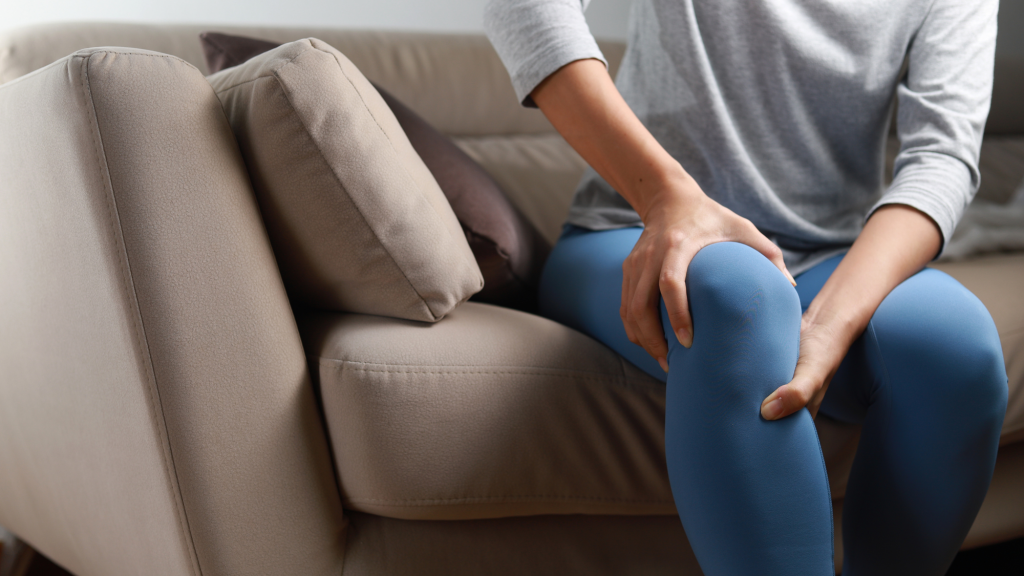 woman hold her knee that is in pain
