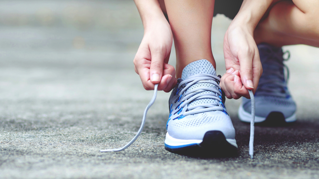 runner getting ready for race by tying shoe in rockville maryland 