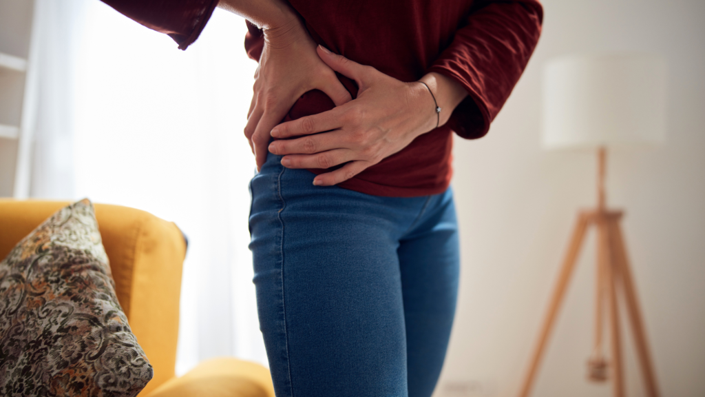 woman holding hip because of hip pain caused by hip labral tear