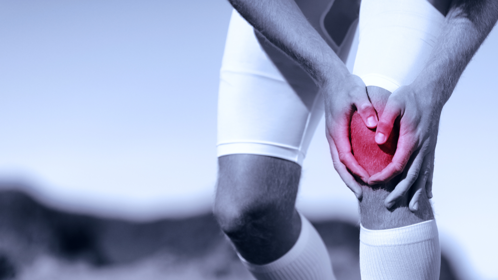 soccer playing holding left knee after tearing acl and going to see chiropractor for recovery