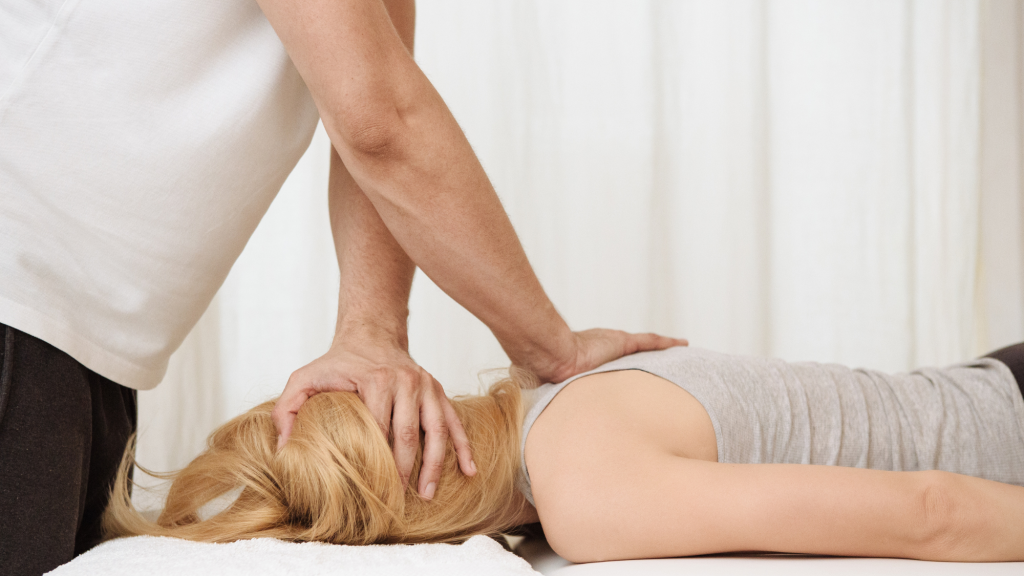 woman getting neck adjustment at chiropractor